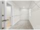 Spacious walk-in closet with carpet, wire shelving on the walls, and entry to the bathroom at 916 Clementine Rd, Monroe, NC 28110