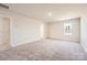 Comfortable bedroom with neutral carpet, and a window allowing ample natural light at 10115 Chatham Run Ln, Charlotte, NC 28262