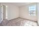 Cozy bedroom with plush carpet and a bright window overlooking the neighborhood at 10115 Chatham Run Ln, Charlotte, NC 28262