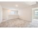 Bright and open loft area with carpet flooring and natural light at 10115 Chatham Run Ln, Charlotte, NC 28262