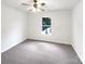 Bedroom featuring soft carpet, ceiling fan, and neutral paint at 10312 Hugue Way, Charlotte, NC 28214