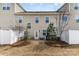 A townhouse backyard features a cozy patio and a well-maintained lawn at 105 Burlingame Ct # B, Mooresville, NC 28117