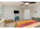 Bedroom featuring a ceiling fan and soft lighting and colorful bedding at 105 Burlingame Ct # B, Mooresville, NC 28117