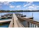 Picturesque view of a well-maintained wooden dock stretching over a calm lake at 105 Burlingame Ct # B, Mooresville, NC 28117