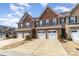 Brick townhouses feature multi-car driveways and attached garages at 105 Burlingame Ct # B, Mooresville, NC 28117