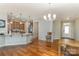 Open layout from kitchen to dining area with modern lighting at 105 Burlingame Ct # B, Mooresville, NC 28117