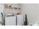 Laundry room featuring white appliances, shelving, and natural light at 105 Burlingame Ct # B, Mooresville, NC 28117