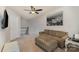 Cozy living room with plush sofa, patterned ottoman, and natural light at 105 Burlingame Ct # B, Mooresville, NC 28117