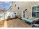 Back patio with brick pavers and outdoor furniture surrounded by a white fence at 105 Burlingame Ct # B, Mooresville, NC 28117