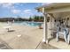 Community pool with lounge chairs under a covered patio offers a relaxing space at 105 Burlingame Ct # B, Mooresville, NC 28117