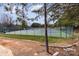 View of fenced-in tennis courts, part of the community's recreational amenities at 105 Burlingame Ct # B, Mooresville, NC 28117