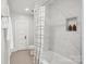 Elegant bathroom with white marble tile and a shower-tub combination with a stylish shower curtain at 1105 Vanizer St, Charlotte, NC 28208