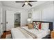 Bright bedroom offers a ceiling fan and a doorway leading to an office at 1105 Vanizer St, Charlotte, NC 28208