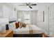 Comfortable bedroom with natural light, fan, and neutral tones at 1105 Vanizer St, Charlotte, NC 28208