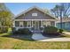 Charming home with a well-manicured lawn, quaint front porch, and beautiful curb appeal at 1105 Vanizer St, Charlotte, NC 28208