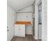 Hallway features a built-in wooden counter space, white shiplap walls, and access to another room at 1105 Vanizer St, Charlotte, NC 28208