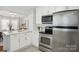 Clean kitchen with white cabinets and stainless steel appliances, providing a modern aesthetic at 1105 Vanizer St, Charlotte, NC 28208