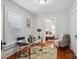 Cozy home office with natural light, a modern desk, and a view into the bedroom at 1105 Vanizer St, Charlotte, NC 28208