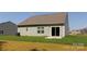 This home features a spacious backyard with lush green grass, perfect for outdoor activities and relaxation at 111 Tradesmen Trl # 75, Troutman, NC 28166