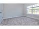An empty bedroom offers natural light, neutral walls, and plush carpeting at 111 Tradesmen Trl # 75, Troutman, NC 28166