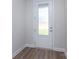 Entryway features wood-look flooring and a modern door with glass pane and white trim at 111 Tradesmen Trl # 75, Troutman, NC 28166