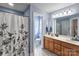 Bathroom with a vanity, toilet, and shower/tub combo at 1232 Pressley Downs Se Dr, Concord, NC 28025