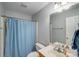 Standard bathroom features a toilet, shower, vanity, and mirror at 1232 Pressley Downs Se Dr, Concord, NC 28025