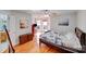 Bright bedroom featuring hardwood floors, natural light, and a comfortable, inviting atmosphere at 1232 Pressley Downs Se Dr, Concord, NC 28025