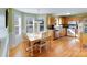 Bright dining area with hardwood floors, large windows, and breakfast nook with great sunlight at 1232 Pressley Downs Se Dr, Concord, NC 28025
