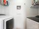 Functional laundry room with washer, dryer, and white walls, providing a clean and efficient space at 1232 Pressley Downs Se Dr, Concord, NC 28025