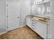 Bright bathroom featuring double sinks, tile flooring, and a neutral color scheme at 12332 Flatbush Dr, Huntersville, NC 28078