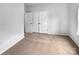 Bright bedroom features neutral walls, carpet, and a closet with three doors at 12332 Flatbush Dr, Huntersville, NC 28078