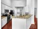 Modern kitchen featuring granite countertops, stainless steel appliances, and ample cabinet space at 12332 Flatbush Dr, Huntersville, NC 28078