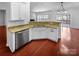 Open kitchen view featuring granite countertops, stainless appliances, and hardwood flooring at 12332 Flatbush Dr, Huntersville, NC 28078
