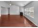 Spacious living room featuring hardwood floors, a fireplace, and plenty of natural light at 12332 Flatbush Dr, Huntersville, NC 28078