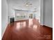 Bright living room with hardwood floors, a fireplace, ceiling fan, and sliding glass doors at 12332 Flatbush Dr, Huntersville, NC 28078