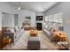 Bright living room showcasing stylish furniture, hardwood floors, and a cozy fireplace at 12332 Flatbush Dr, Huntersville, NC 28078