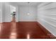 Open living space featuring hardwood floors, recessed lighting, and an adjacent kitchen at 12332 Flatbush Dr, Huntersville, NC 28078