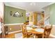 Cozy dining room with wooden table, decorative mirror, and warm, inviting colors at 12421 Poplar Forest Dr, Charlotte, NC 28278