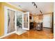 Bright kitchen featuring a view of a serene sunroom, oak cabinets, and modern appliances at 12421 Poplar Forest Dr, Charlotte, NC 28278