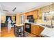 Traditional kitchen with oak cabinets, black appliances, white countertop, and an eat-in breakfast nook at 12421 Poplar Forest Dr, Charlotte, NC 28278