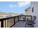 Balcony with patterned tile and chairs overlooking community buildings at 12461 Bryton Ridge Pkwy, Huntersville, NC 28078