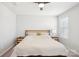 Well-lit bedroom featuring a ceiling fan and carpet flooring at 12461 Bryton Ridge Pkwy, Huntersville, NC 28078