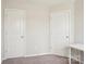 Bedroom with two white doors on the wall near a desk on the side at 12461 Bryton Ridge Pkwy, Huntersville, NC 28078