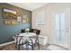 Stylish dining nook featuring a built-in bench, round table, and decorative wall art at 12461 Bryton Ridge Pkwy, Huntersville, NC 28078