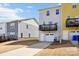 A view of townhomes featuring private garages, balconies and neutral color schemes at 12461 Bryton Ridge Pkwy, Huntersville, NC 28078