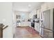 Bright kitchen featuring white cabinets, stainless steel appliances, and modern finishes at 12461 Bryton Ridge Pkwy, Huntersville, NC 28078