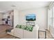 Cozy living room with a modern sofa and mounted television, adjacent to the kitchen at 12461 Bryton Ridge Pkwy, Huntersville, NC 28078