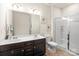 Bathroom with a double sink vanity and a glass-enclosed shower at 12614 Chantrey Way, Huntersville, NC 28078