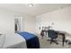 This spacious bedroom features a cozy desk, comfortable carpet, and lots of natural light at 12614 Chantrey Way, Huntersville, NC 28078